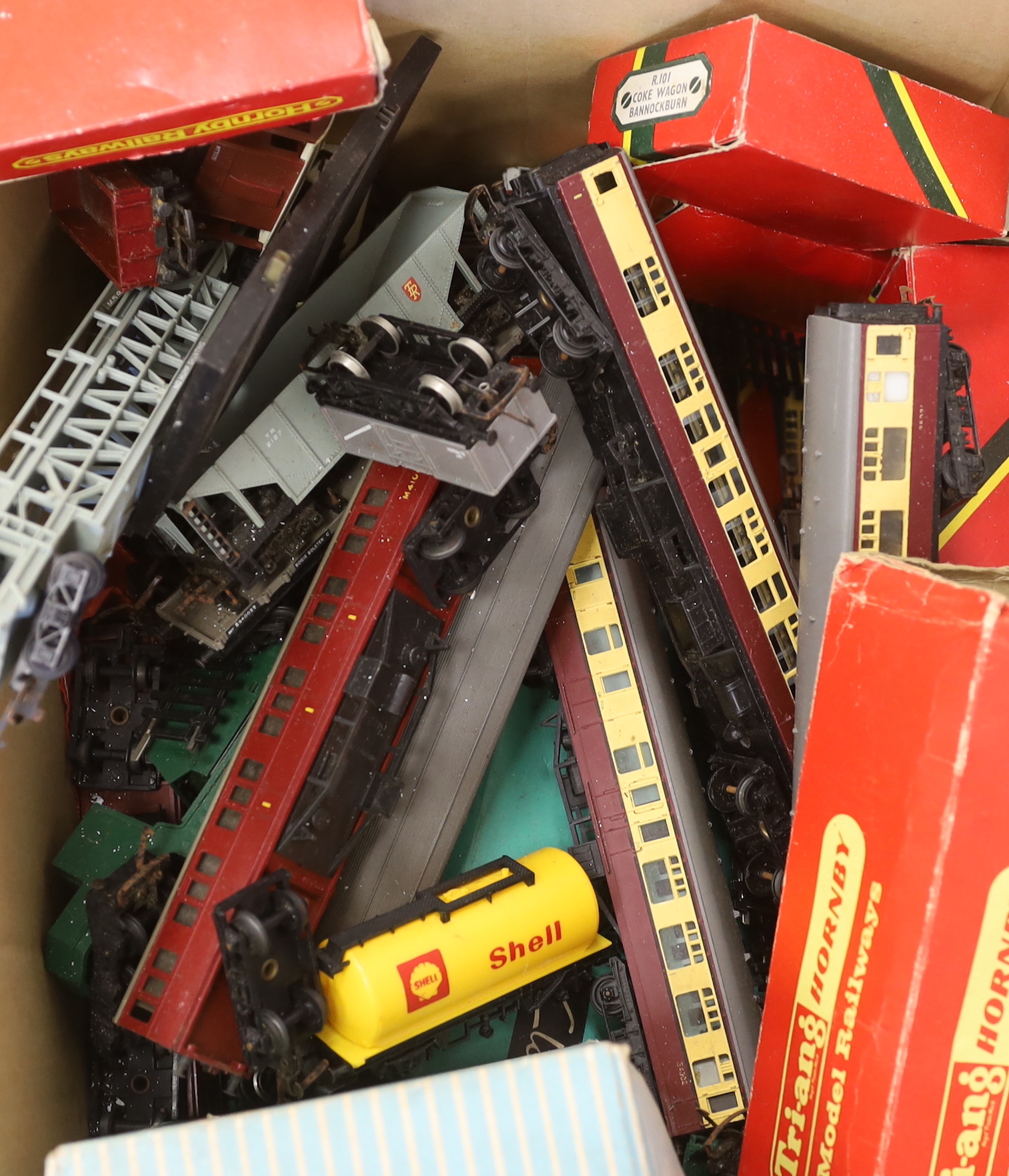 A collection of playworn diecast vehicles by Dinky Toys, Corgi Toys, Matchbox, etc., together with Tri-ang and Tri-ang Hornby OO gauge model railway including coaches, wagons and track sections, etc. (4 boxes)